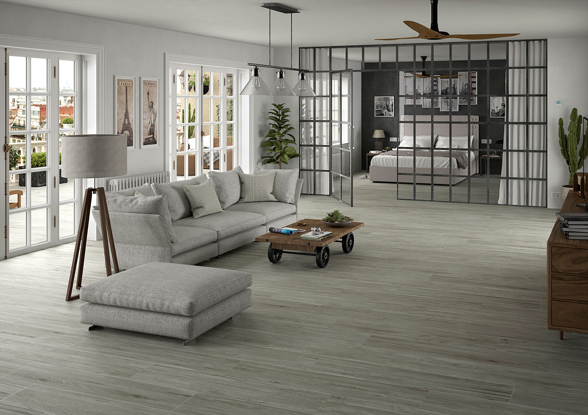 Salón abierto con suelo porcelánico efecto madera, sofá gris, mesa baja y mampara metálica