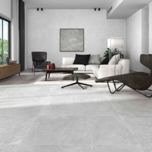 Exposición de salón con suelos y paredes cerámicos gris claro y mobiliario minimalista