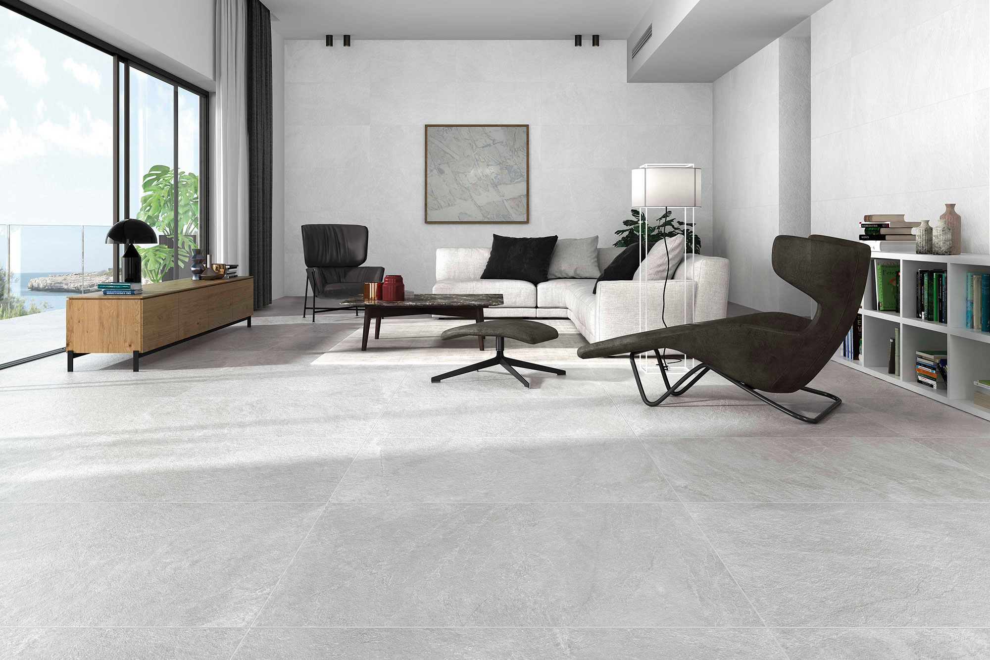 Exposición de salón con suelos y paredes cerámicos gris claro y mobiliario minimalista