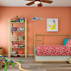 Habitación infantil en exposición: pared de azulejo efecto ladrillo salmón y suelo cerámico madera.