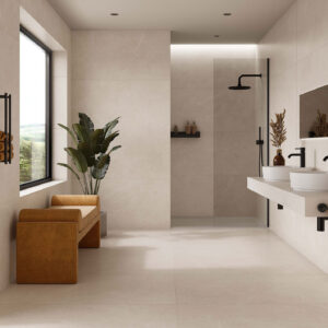 Baño minimalista con revestimiento cerámico crema, ducha abierta y doble lavabo