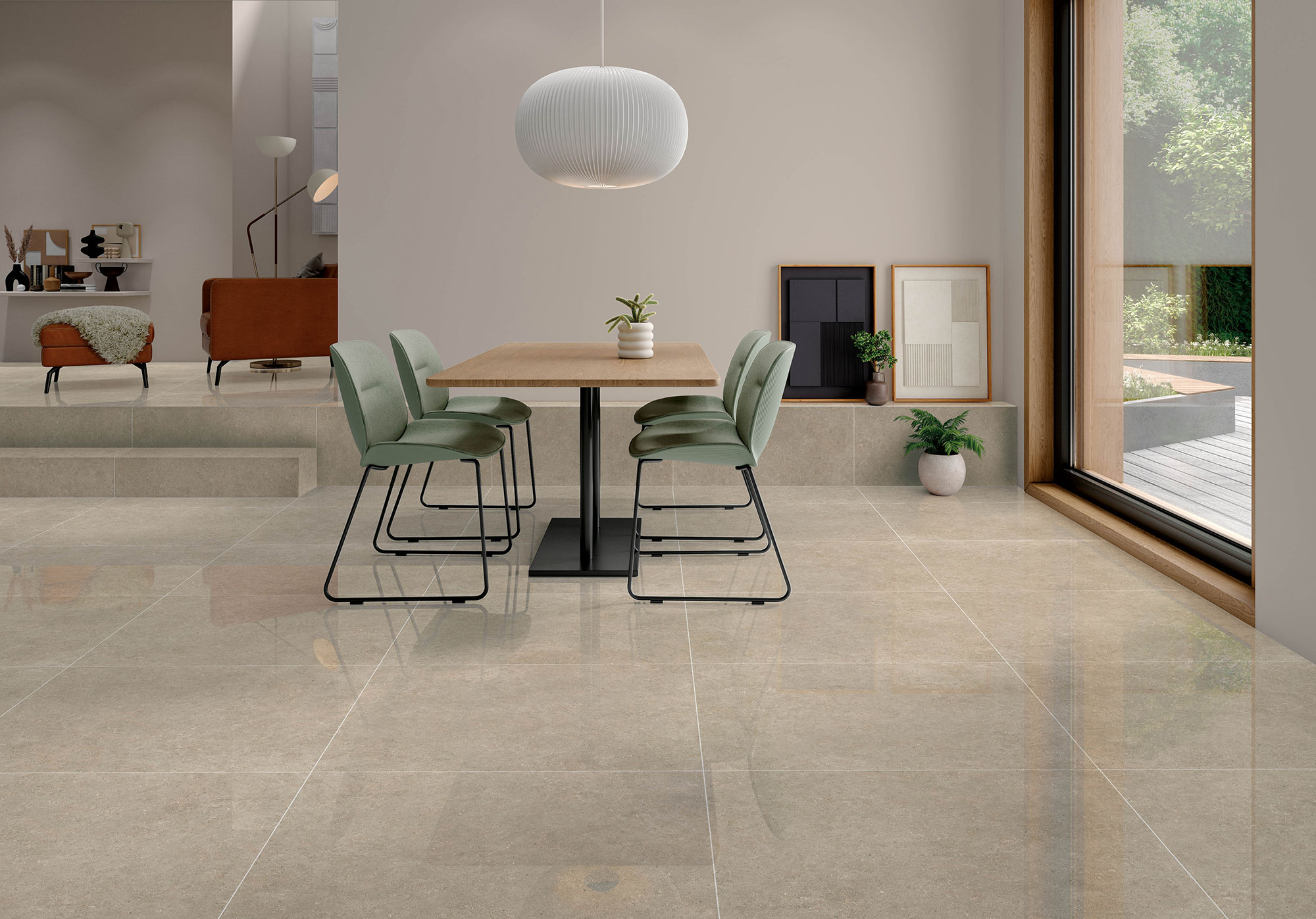 Sala moderna con mesa y sillas verdes sobre pavimento cerámico beige pulido y gran ventanal