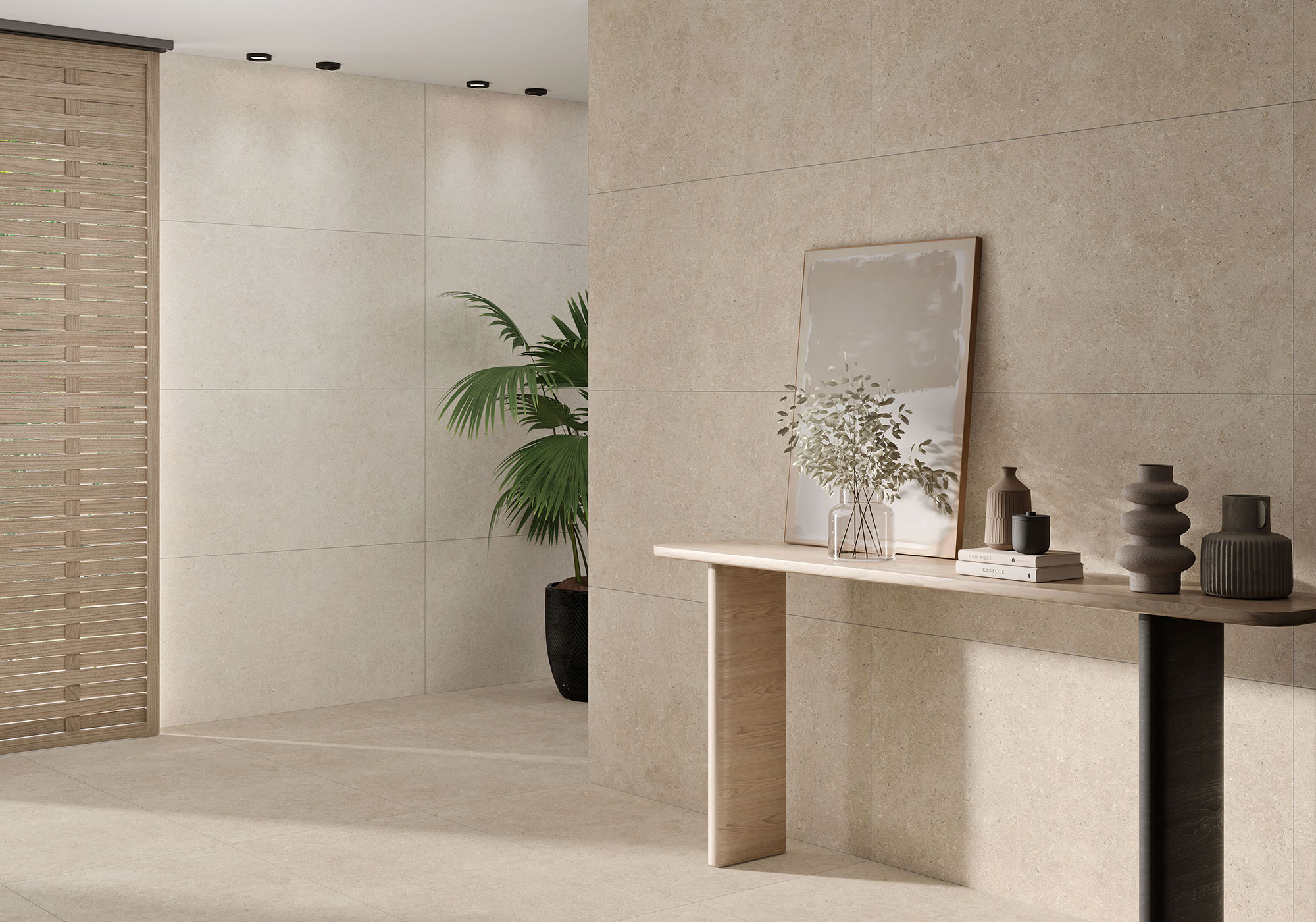 Exposición de azulejos beige gran formato en suelo y pared, consola y planta