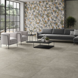 Salón pavimento baldosa gris y pared revestimiento cerámico geométrico