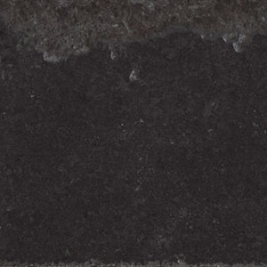 Azulejo rectangular oscuro efecto hormigón, borde desgastado y brillo parcial