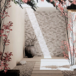 Pasillo expositivo con losas cerámicas, cama de guijarros y muro de ladrillo iluminado