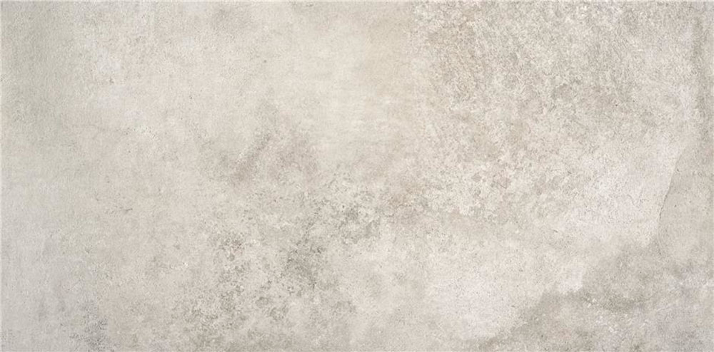 Baldosa cerámica efecto hormigón gris claro con textura moteada