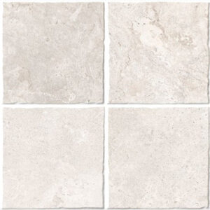 Muestra de ocho azulejos cuadrados beige con texturas y juntas visibles