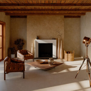 Sala de exposición con suelo cerámico, chimenea blanca, butacas de cuero y decoración