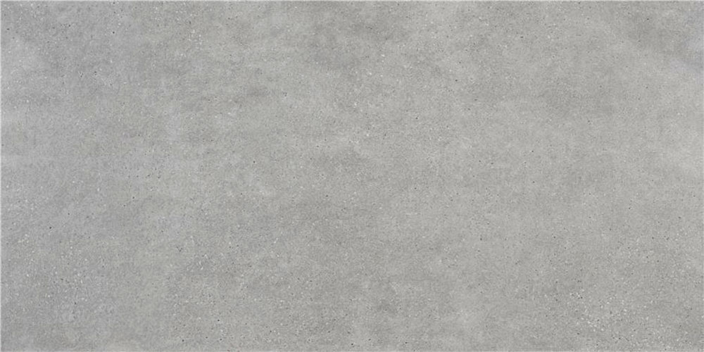 Baldosa cerámica efecto hormigón gris liso con textura sutil