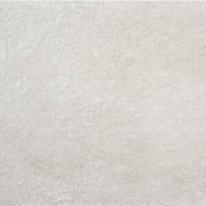 Baldosa cerámica efecto hormigón gris claro mate con textura sutil y microgranos