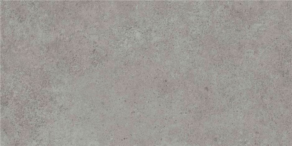 Baldosa porcelánica efecto hormigón gris claro con textura moteada