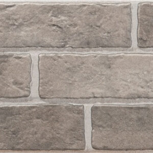 Revestimiento cerámico efecto ladrillo en tonos topo y textura rugosa