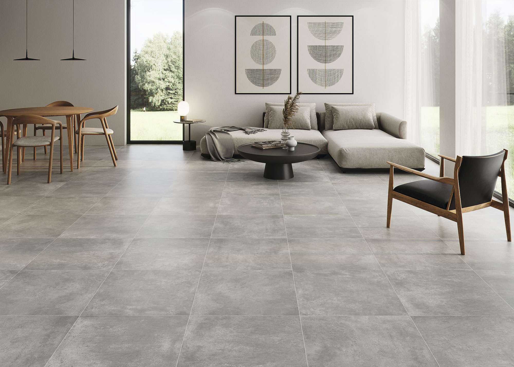 Exposición de pavimento cerámico gris gran formato en sala moderna con mobiliario minimalista.