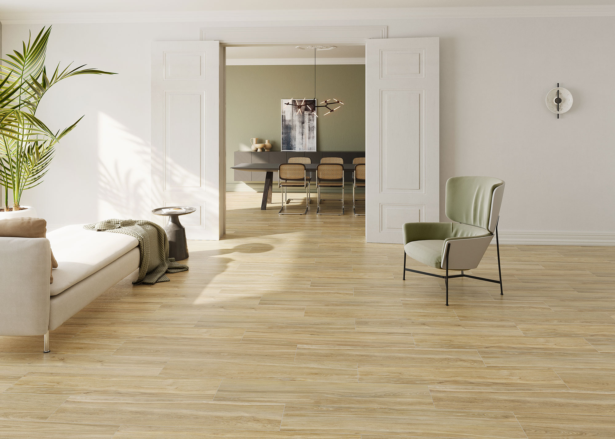 Espacio abierto con pavimento cerámico efecto madera roble claro y mobiliario minimalista