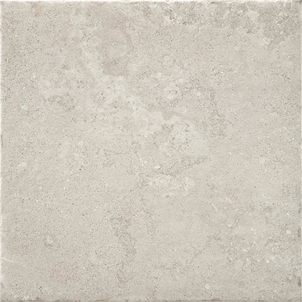 Azulejo cerámico cuadrado beige claro con textura de piedra y acabado mate