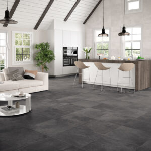 Suelo cerámico gris oscuro en losas grandes de salón-cocina moderno