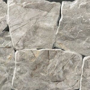 Revestimiento cerámico imitación piedra irregular gris con juntas visibles