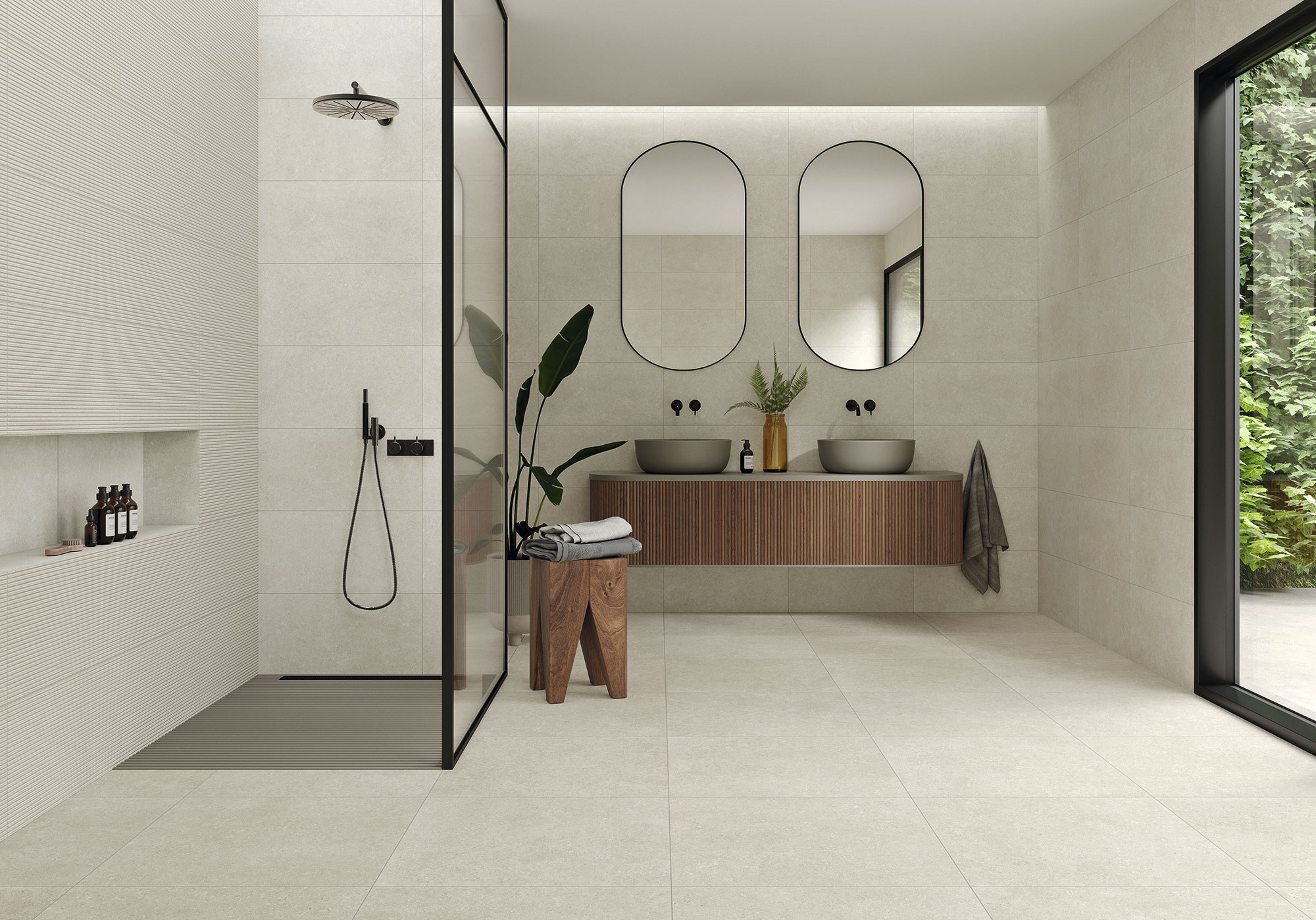 Baño moderno con azulejos beige, ducha de vidrio, mueble flotante de madera y doble lavabo