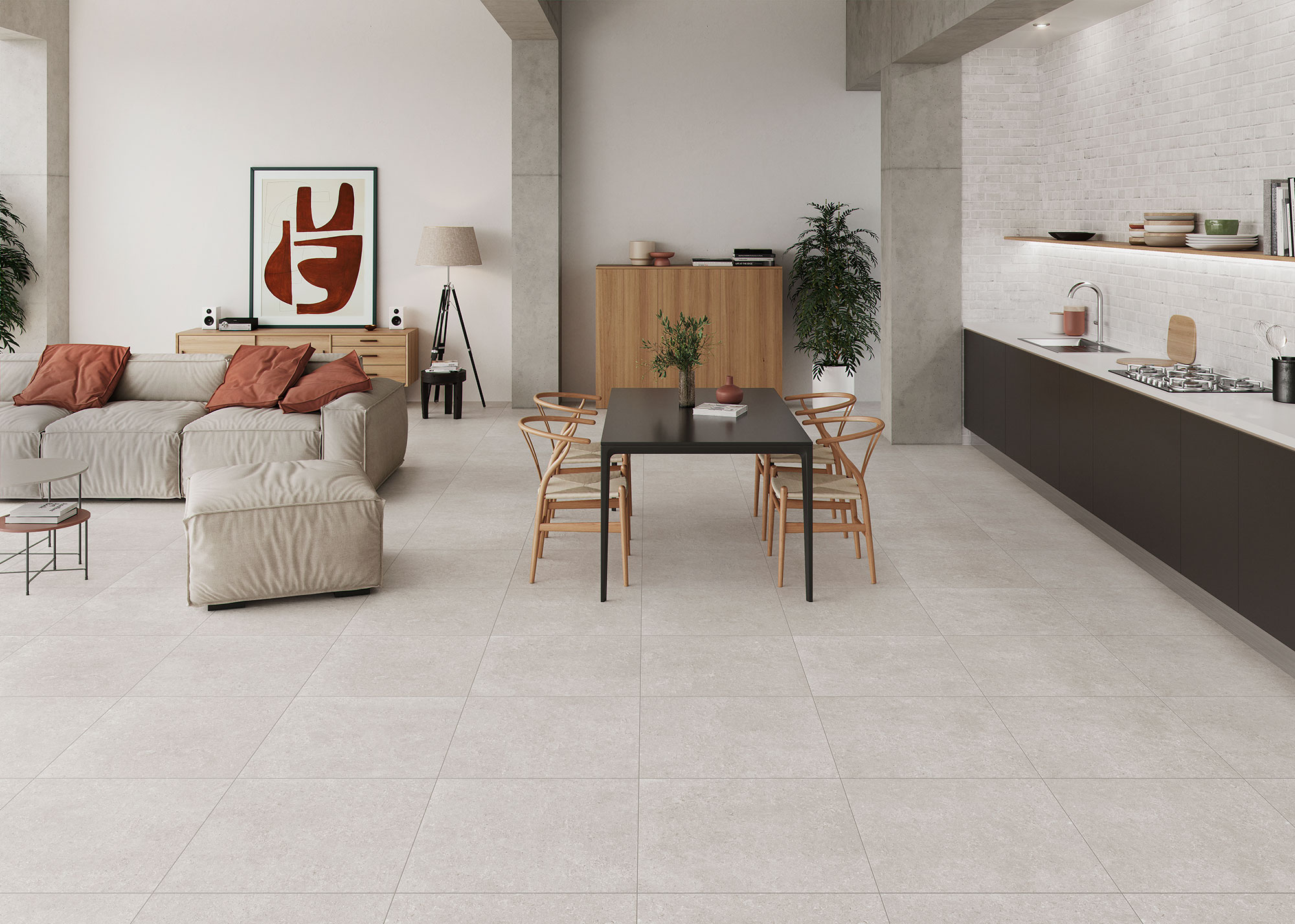 Salón-cocina abierto con pavimento cerámico gris claro, sofá beige y mesa de comedor negra