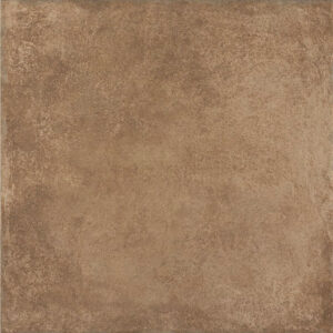 Baldosa cerámica cuadrada marrón tono tierra con textura envejecida tipo piedra