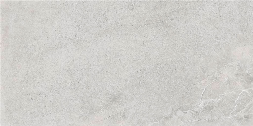 Baldosa cerámica gris claro efecto cemento con vetas sutiles