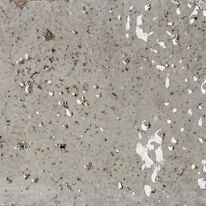 Azulejo cerámico rectangular con esmalte brillante gris-beige y motas oscuras