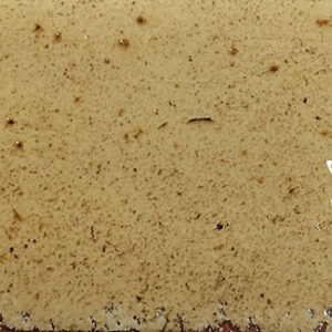 Azulejo cerámico rectangular beige jaspeado con brillo y motas marrones