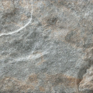 Ordesa-Mix-12,5x25 Azulejo efecto piedra gris con vetas blancas y tonos marrones, textura rugosa.