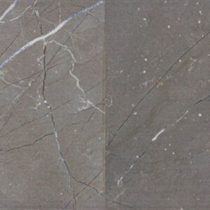 Baldosa cerámica gris marrón con vetas blancas y motas sutiles tipo mármol