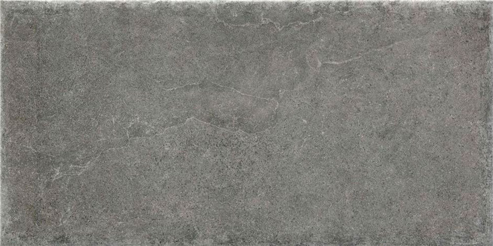 Baldosa cerámica rectangular gris con textura de piedra y vetas suaves