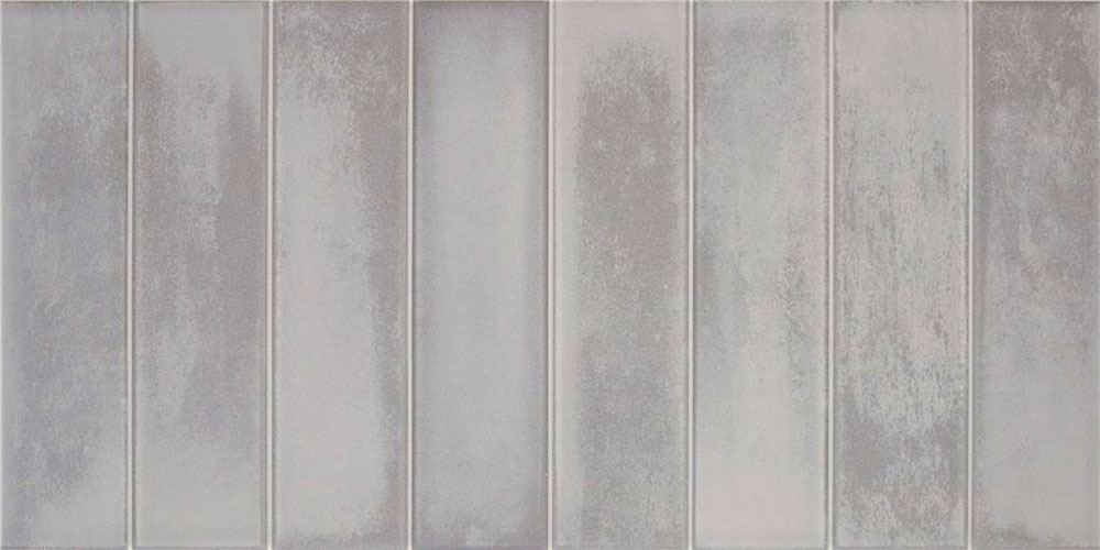 Azulejos rectangulares grises con textura mate y juntas verticales