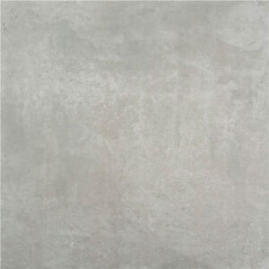 Baldosa cerámica gris efecto hormigón mate con sutil textura