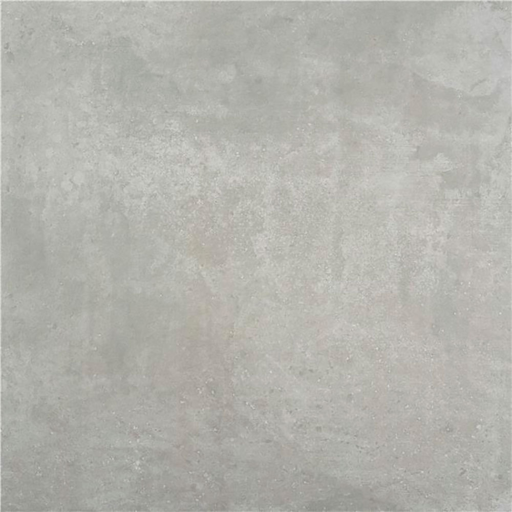 Baldosa cerámica gris efecto hormigón mate con sutil textura