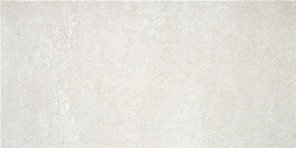 Baldosa cerámica rectificada color crema textura mate y sutil efecto piedra
