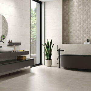 STN-AMB-BELLEVUE-WHITE_GREY-33,3X90+GREY-60X60 Baño moderno con azulejos crema, bañera negra y lavabo flotante
