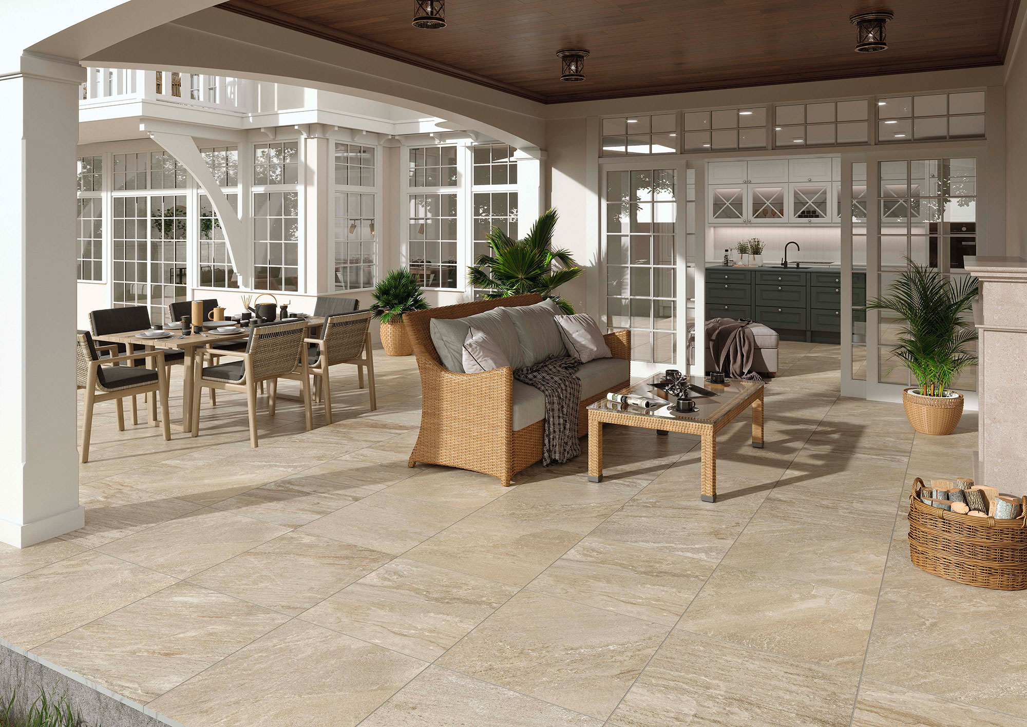 STN-AMB-ICARIA-OCRE-60X60-ESPESORADO Terraza cubierta con pavimento cerámico beige efecto piedra y mobiliario rattan