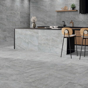 Cocina pavimento revestimiento cerámico gris efecto mármol península taburetes