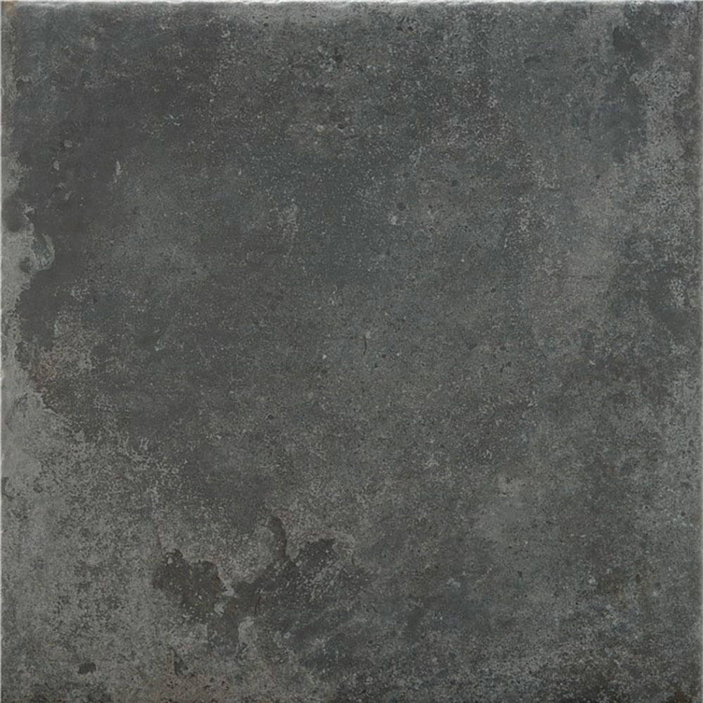Saint-andrews-antracita-60x60 Baldosa cerámica gris oscuro con textura envejecida y acabado industrial.