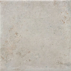 Saint-andrews-gris-60x60 Baldosa cerámica efecto hormigón gris claro con moteado y sutiles manchas beige