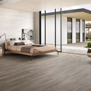 Dormitorio moderno con pavimento y revestimiento cerámico efecto madera gris
