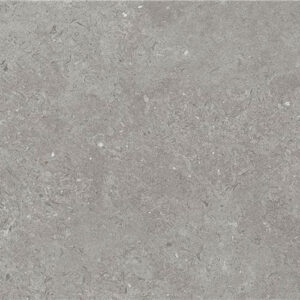 Baldosa cerámica gris efecto piedra con textura sutil y motas claras