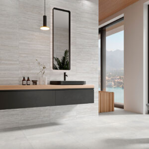 Baño moderno con azulejos beige y suelo cerámico, mueble flotante negro y ventana al lago