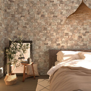 Dormitorio con revestimiento cerámico piedra beige, cama y decoración natural