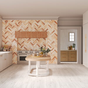 Cocina con azulejos en espiga terracota, isla de madera y muebles blancos