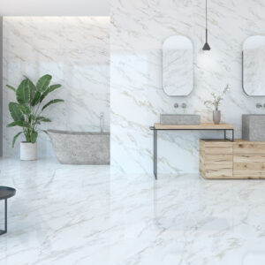 AMB-1-CALACATTA-GOLD Exposición: suelo y paredes cerámicos efecto mármol, bañera, doble lavabo y mobiliario