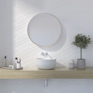 Lavabo sobre encimera flotante de madera con espejo redondo y azulejos cerámicos texturados