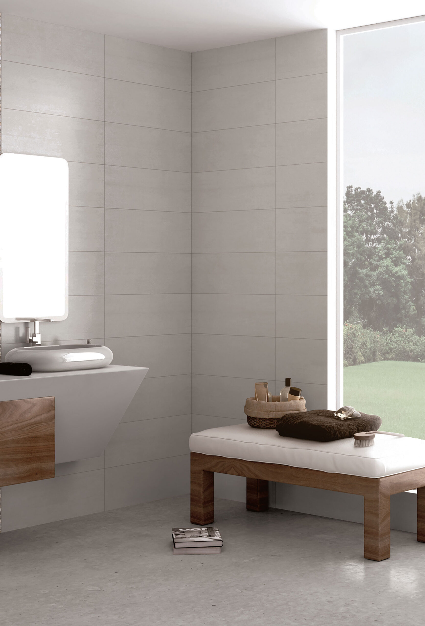 Baño exhibición con azulejos grises rectangulares, lavabo flotante y banco de madera junto a ventana