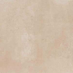 Azulejo cerámico beige jaspeado con textura mate tipo hormigón