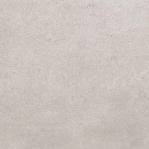 Azulejo cerámico efecto cemento beige claro, textura mate con sutiles vetas